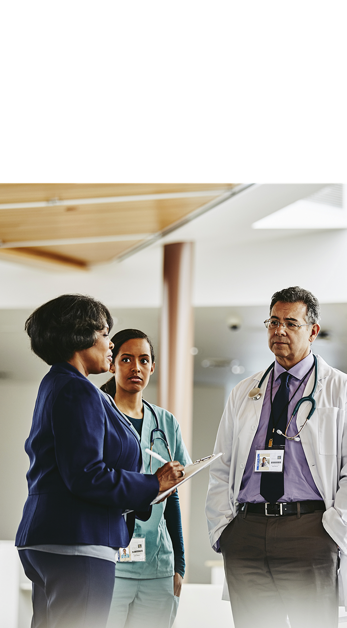 A group of healthcare professionals in discussion, reflecting Astellas’ commitment to supporting HCPs with clinical trial resources and patient-focused tools.